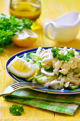 Salad from rice,calamari and fresh cucumber.