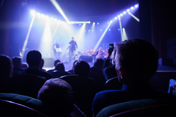 Audience watching the scene with artists.