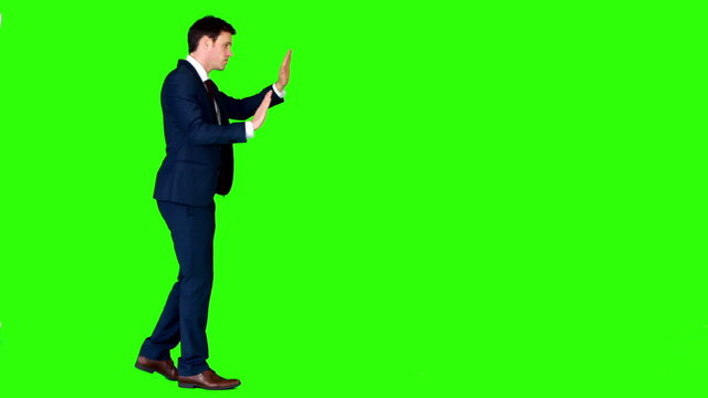 Businessman pushing something