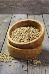 Dry lentils in a wooden bowl