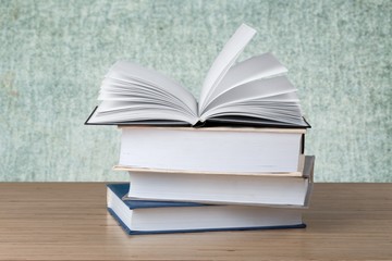 Book. A pile of books with library on the back