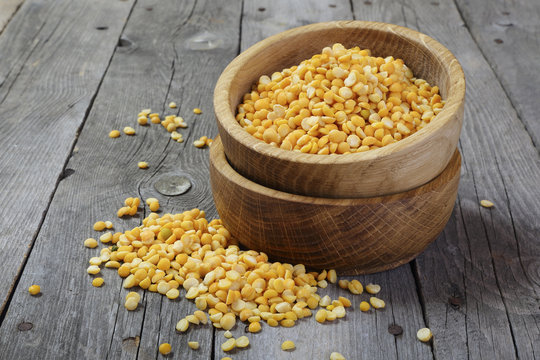 Yellow split peas in a wooden bowl