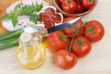 Raw chicken breasts on cutting board