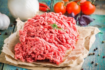 fresh raw ground beef on a paper