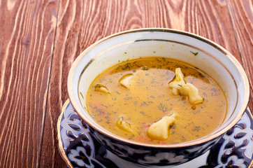 Bowl of chicken soup with vegetables and noodles