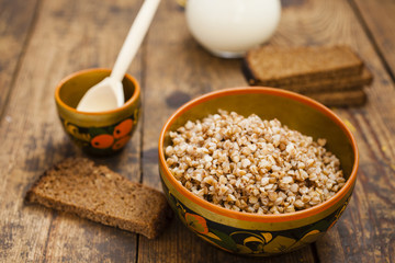 buckwheat cereal in a bowl on a table, selective focus