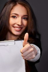 Portrait of  business woman with paper folder,smiles