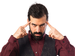 Man wearing waistcoat thinking