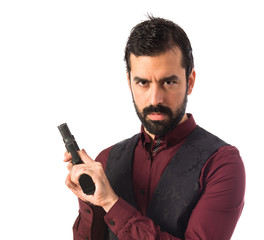 Man wearing waistcoat with a pistol