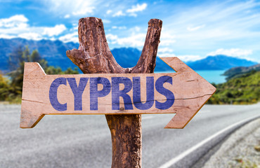 Cyprus wooden sign with road background