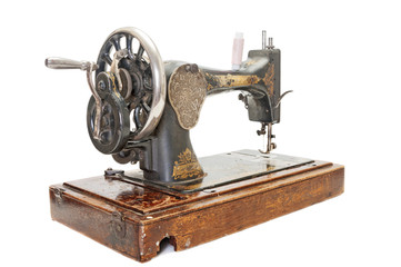 Old sewing machine on white background