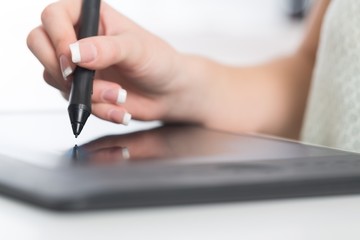 Editing. Side view of a casual male photo editor using graphics