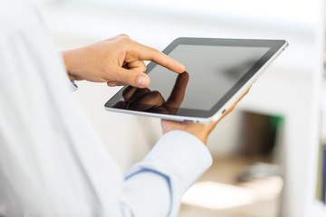 Tablet. Man holding digital tablet, closeup