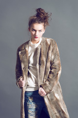 fashion woman in  brown fur coat pose