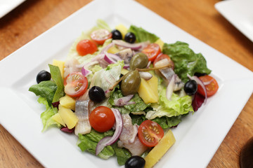 Vegetable salad with herring