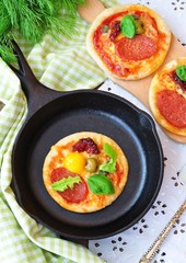 Pepperoni pizza and egg for breakfast