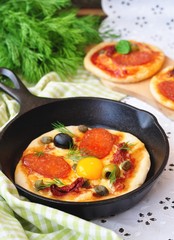 Pepperoni pizza and egg for breakfast