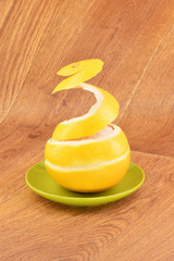 Ripe grapefruit on a wooden background