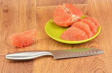 Ripe grapefruit on a wooden background