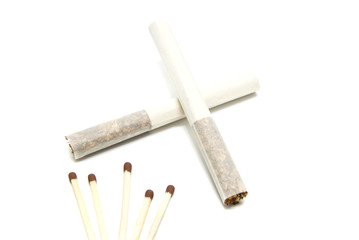 two cigarettes without filter and few matches