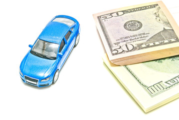 dollar notes and blue car