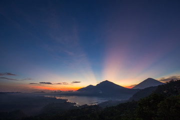 Fototapeta na wymiar Wonderful sunrise near volcano and lake Batur. Bali, Indonesia