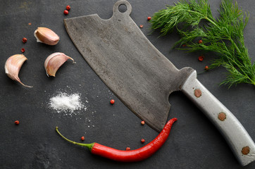 Vintage cleaver with herbs and spices