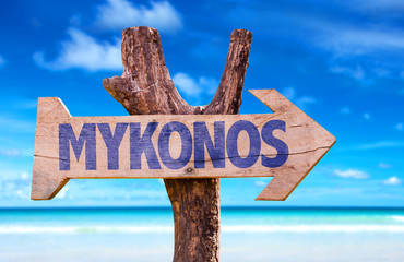 Mykonos wooden sign with beach background