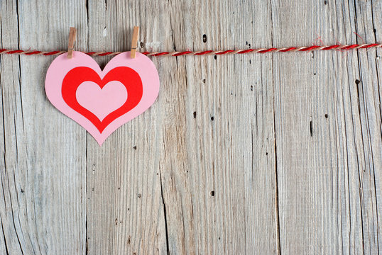 Paper heart on old wooden background