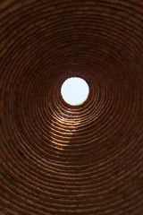 Fototapeta na wymiar sunlight through the circle of ancient roof block