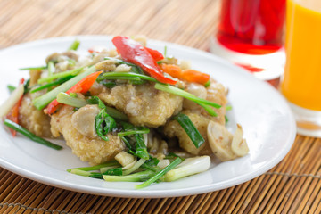 Thai food. deep fried fish stir with sweet sauce and celery