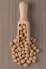 Wooden scoop with chickpeas