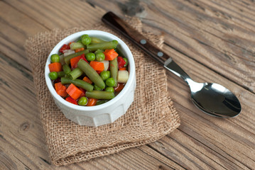 Vegetable soup on old wooden table