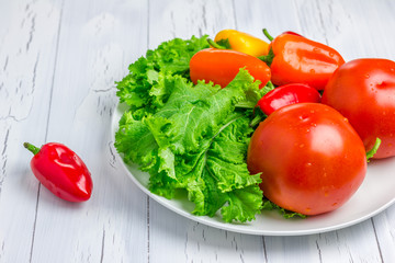 Fresh mixed vegetables on the white plate
