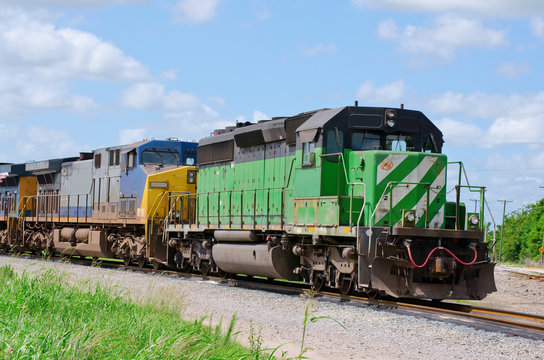Fototapeta Train towing another train speeding down the track