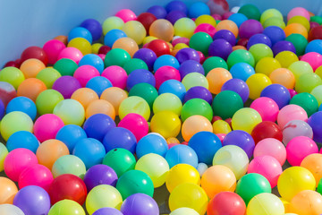 Fototapeta na wymiar colorful plastic ball floating on water in the pool