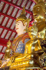 asian angel and golden buddha statue