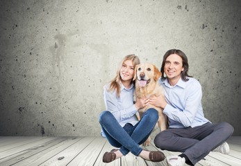 Store. Happy couple taking their beautiful dog to the vet