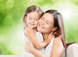 Mother. Family, child and happiness concept - hugging mother and