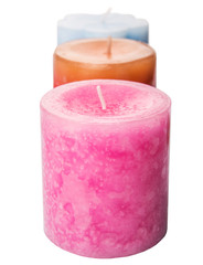 Pink, blue and brown colored aromatic candle 