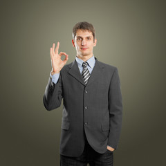 businessman shows OK