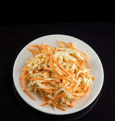 unusual sweet salad on a black background