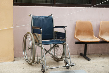 Fototapeta na wymiar wheelchair beside the wall