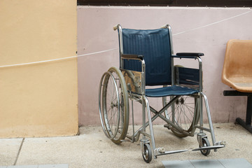 wheelchair beside the wall