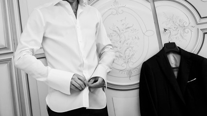 man buttons white shirt © elitravo