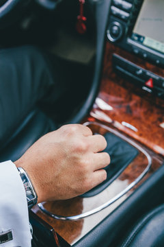 Man Driving a Luxury Car