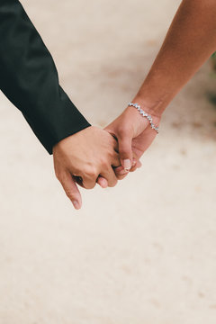 Couple Clutching Hands