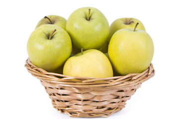 wicker basket with green apples