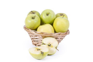 wicker basket with green apples