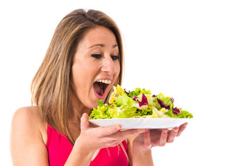 Sport woman holding a salad